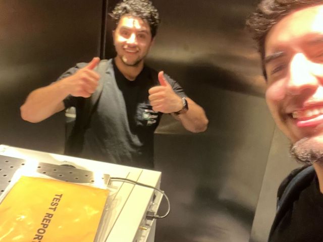 Andrew and Yousef moving an incubator