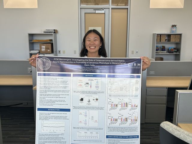 That's the smile of someone who is really happy with her poster! Good luck at your conference, Cat!